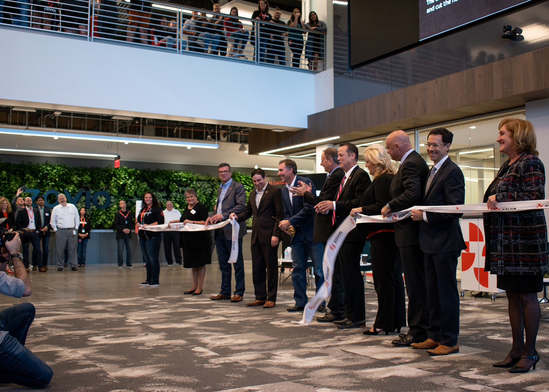 Andrew Clark, Zovio's founder, president and CEO, cut the ceremonial ribbon to celebrate the company's new corporate headquarters in Chandler, Ariz. (Graham Bosch/Chamber Business News)